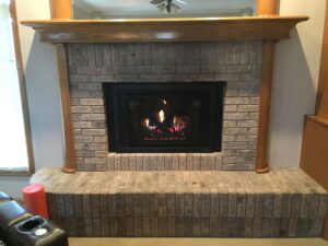 wood and stone fireplace